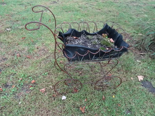 Metal baby buggy plant holder