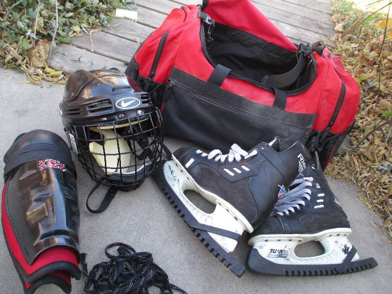 Hockey skates, helmet and guards in...