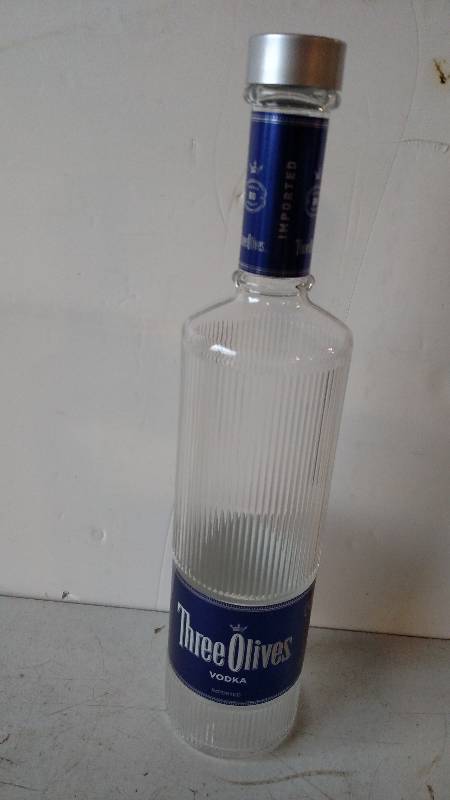 lot 30 image: Three Olives Vodka Bottle, 23...