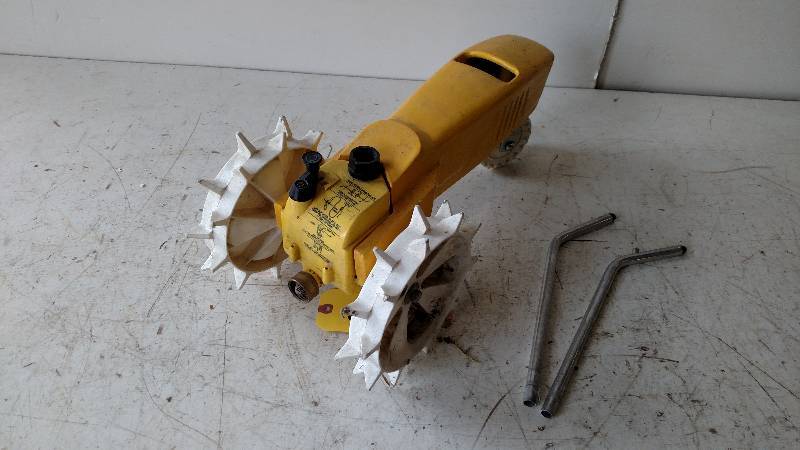 lot 135 image: Cast Iron Traveling Tractor Sprinkl...