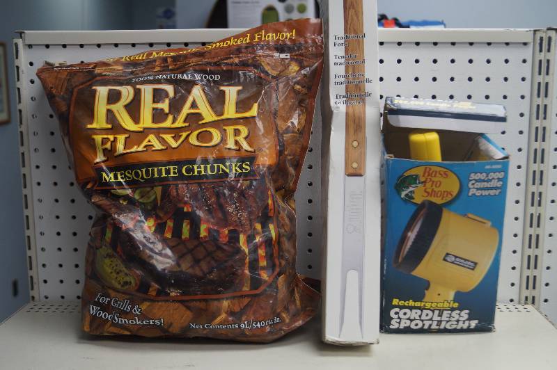 lot 24 image: Smoker chips, spotlight, and weber fork