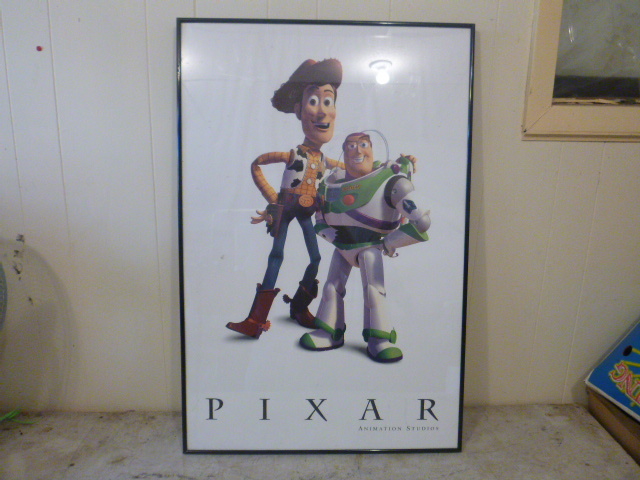 lot 228 image: Pixar Buzz Lightyear and Wood Framed Poster