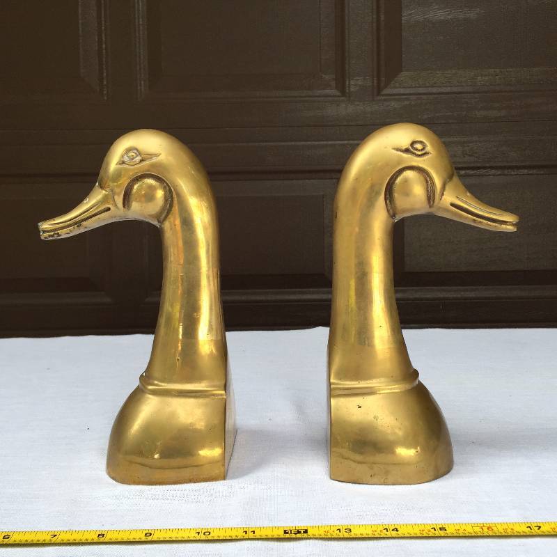 Sold at Auction: 2 PAIR BRASS DUCK HEAD BOOKENDS