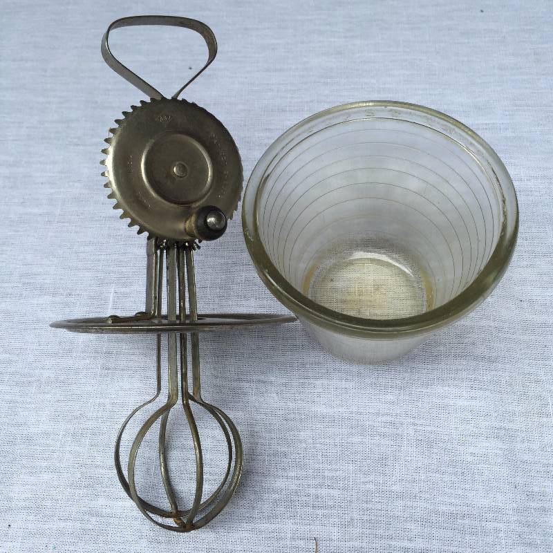lot 013 image: Vintage 1923 A & J Hand Mixer Beaters & Splash Guard Original Measuring Glass Bowl Antique Mid Century Kitchen tool blender Crank style All Metal Cooking Baking Farmhouse Pantry Original Jar Patented Oct. 9, 1923 Made in USA Americana Collectible