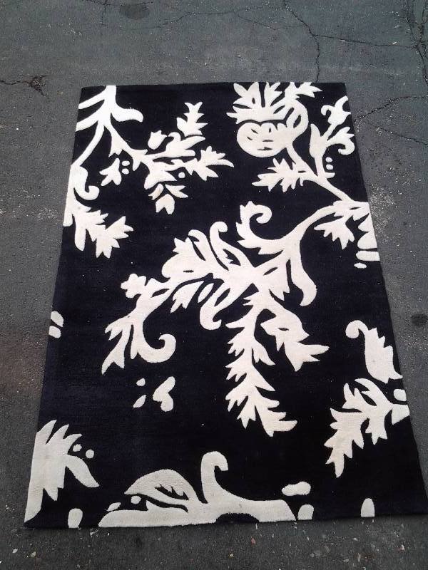 lot 114 image: Black & White Wool Rug
