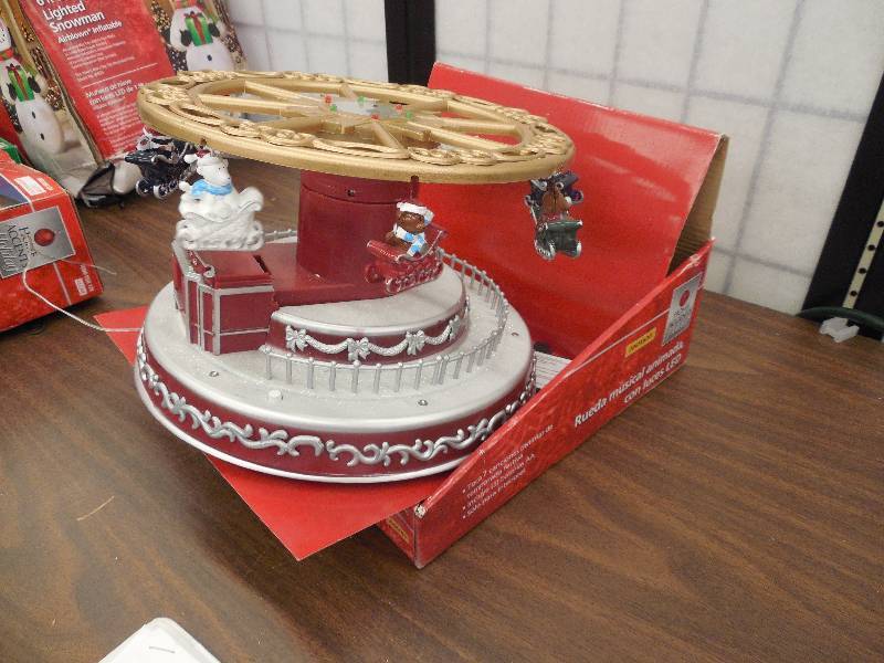 lot 3 image: HOLIDAY HOME ACCENTS  Animated Turning & Telescoping Tilt-A-Wheel with LED Lights,