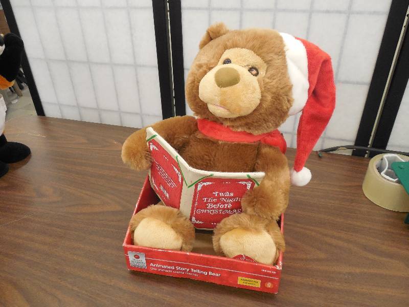 lot 30 image: Home Accents Holiday 10.5 in. H Animated Storytelling Bear