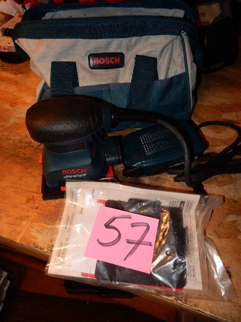 lot 57 image: BOSCH Palm Sander and Bag