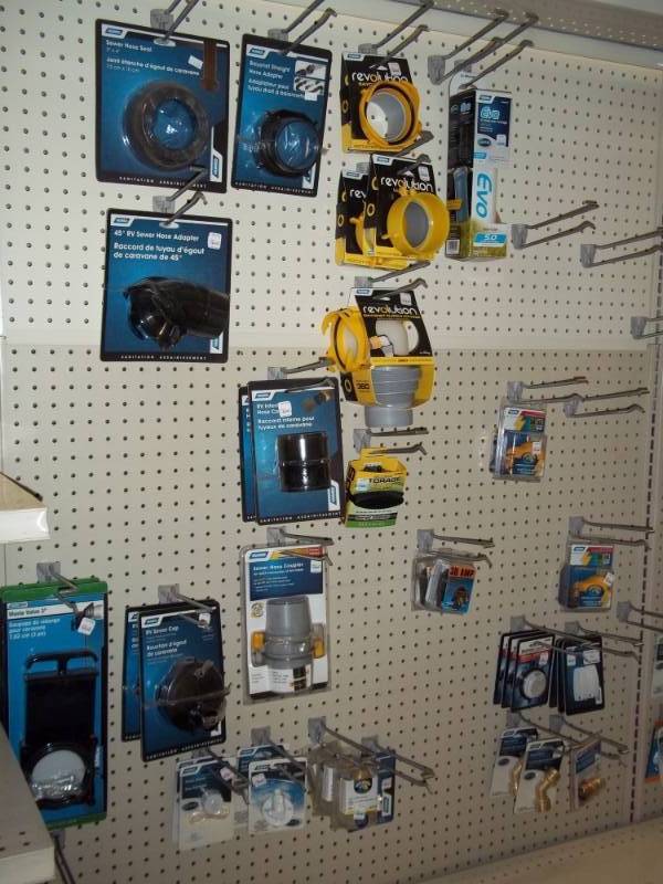 lot 141 image: Wall Lot RV Supplies includes levels, sewer caps, waste valves etc