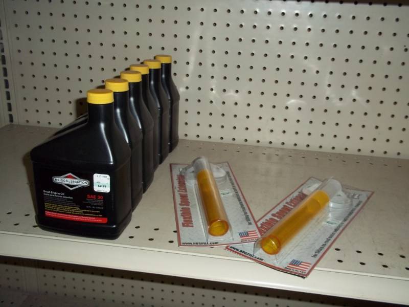 lot 148 image: Shelf Lot Small Engine oil and Funnels