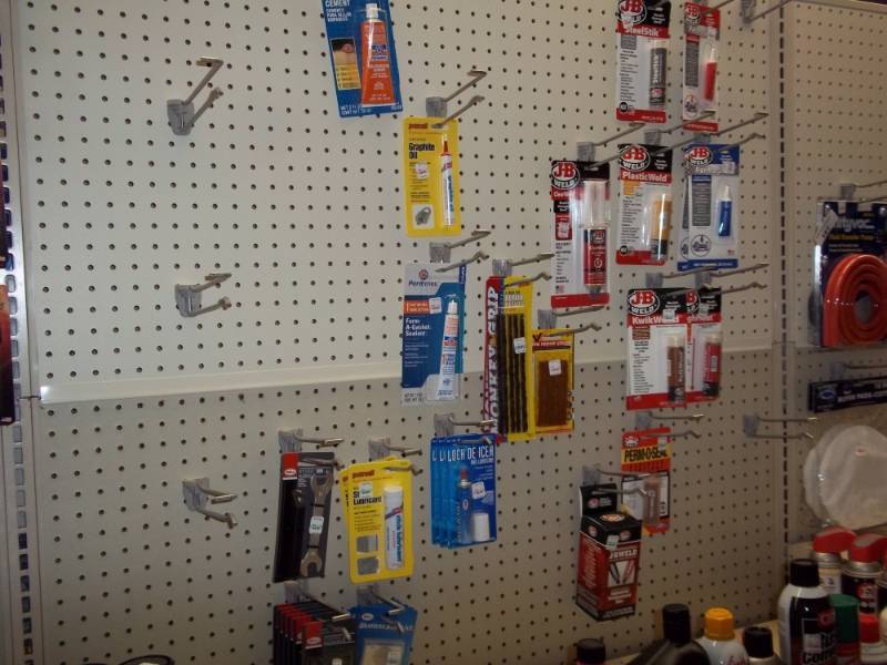 lot 170 image: Wall Lot includes JB Weld, Tire Repair Parts, Form A Gasket