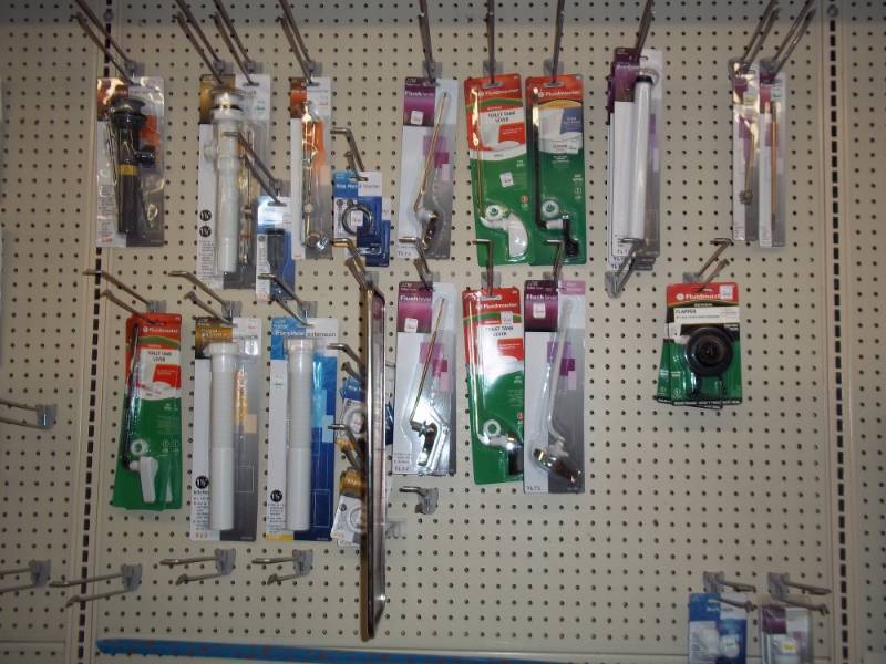 lot 208 image: Wall Shelf Lot Top Half includes Misc toilet repair plumbing