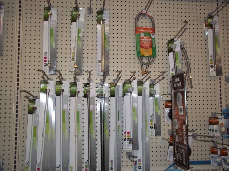 lot 210 image: Wall Shelf Lot Top Half includes Misc faucet supply lines