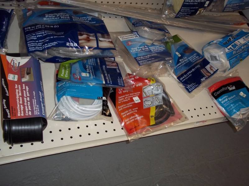 lot 256 image: Shelf Lot Bottom includes Foam weather striping, plastic sheeting, etc