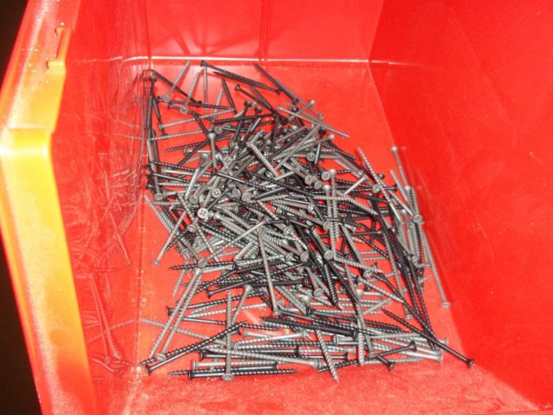 lot 292 image: Red Stacking Bin Full of Sheet Rock Screws 3 in
