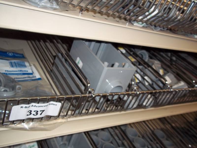 lot 337 image: 4 ft Shelf of Conduit parts, Electrical parts, electrical plates, outdoor Switches