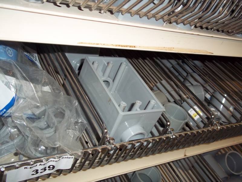 lot 339 image: 4 ft Shelf of Conduit parts, Electrical parts, electrical plates, outdoor Switches