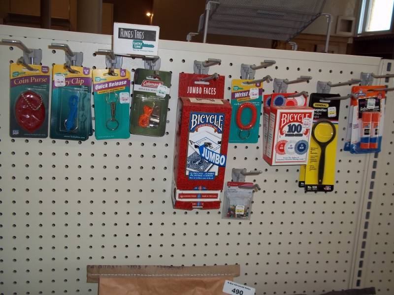 lot 493 image: Wall Shelf Including Playing Cards, Key Rings, etc