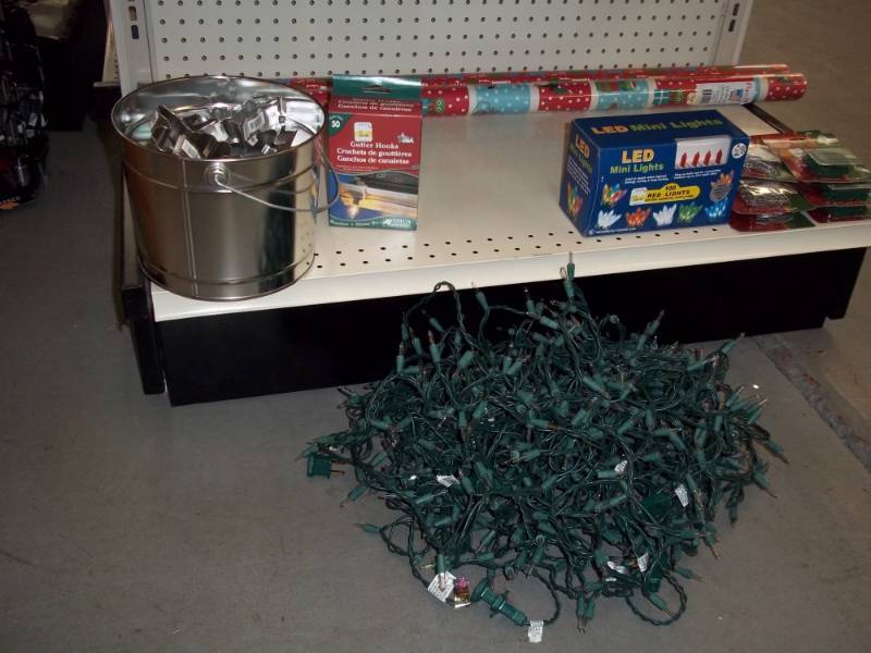 lot 499 image: Shelf Lot including Cookie Cutters, LED Lights, Wrapping Paper, used set String Lights, etc