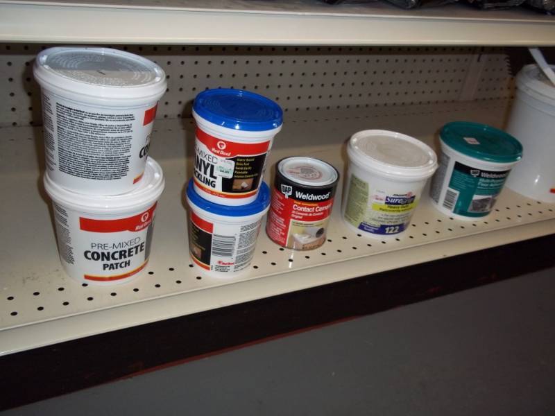 lot 530 image: Shelf Lot includes concrete patch, Floor Adhesive, etc