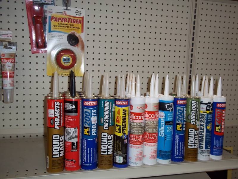 lot 536 image: Shelf Lot includes Liquid Nails, Silicone, etc  32 Tubes