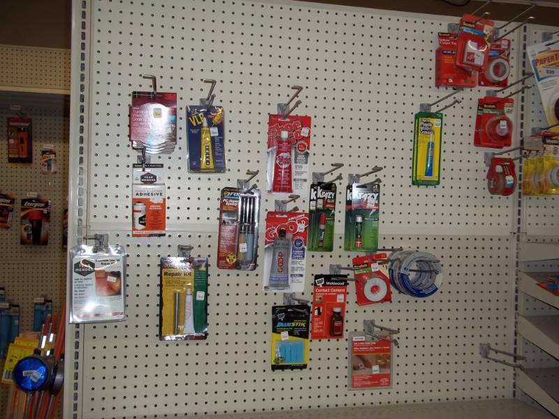 lot 548 image: Wall Lot includes Variety of tape, adhesives, Vinyl Repair Kits, etc