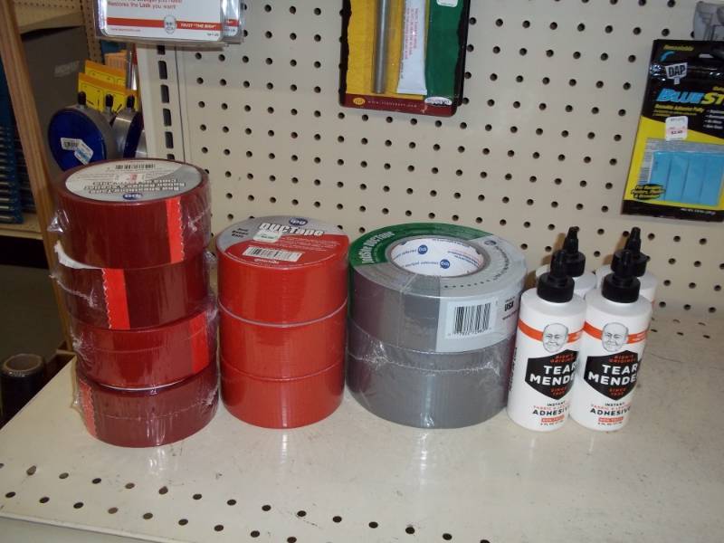 lot 553 image: Lot of Red Duct Tape and Tear Mend Adhesive