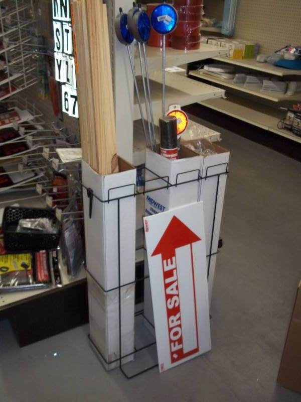 lot 563 image: Lot of Misc Driveway Stakes and Markers, Sign Holders and Display Stand