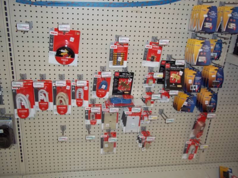 lot 613 image: 4 ft Wall Lot Bottom Half includes Signal Splitters, phone accessories, etc