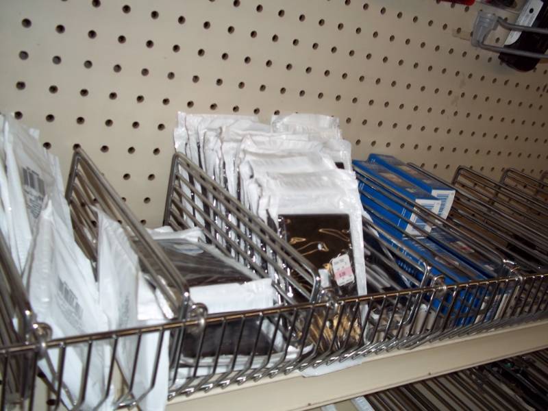 lot 701 image: Shelf Lot Assortment of wall plates, electrical plugins and switches