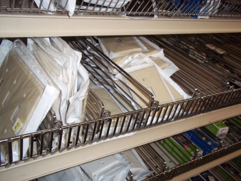 lot 702 image: Shelf Lot Assortment of wall plates, electrical plugins and switches