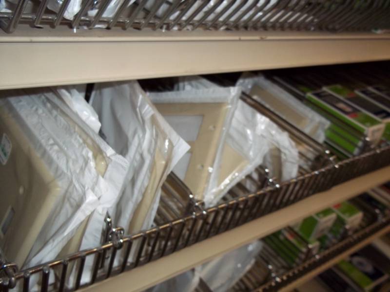 lot 704 image: Shelf Lot Assortment of wall plates, electrical plugins and switches