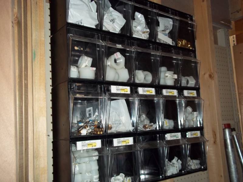 lot 728 image: Plastic Shelving Display with Plumbing Parts  Need tools to remove