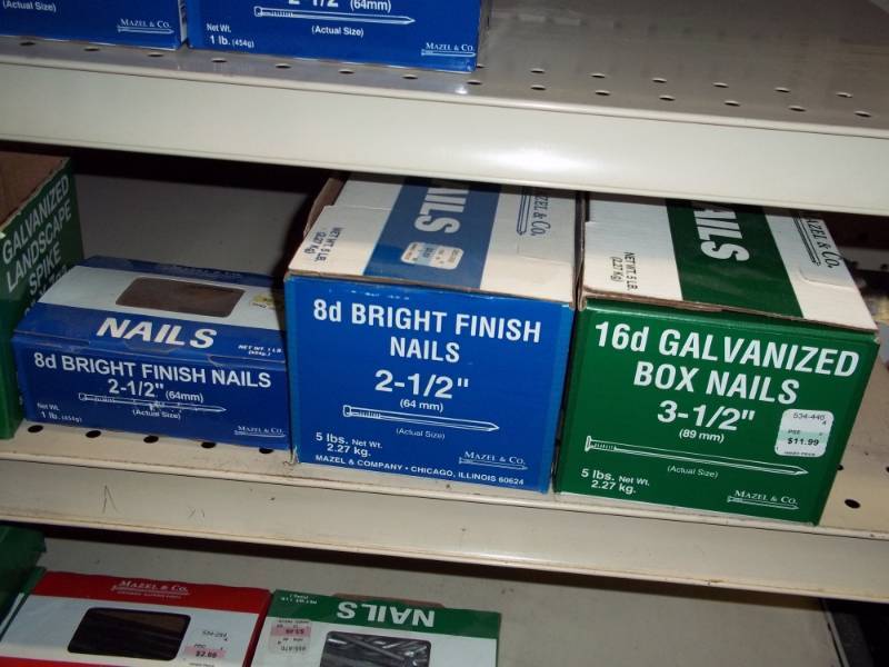 lot 806 image: Shelf Lot of 11 lbs of Nails and Partial Box of Landscape Spikes