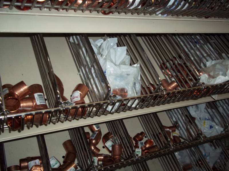 lot 1069 image: 4 ft shelf Lot of Copper Fittings and PVC Valves