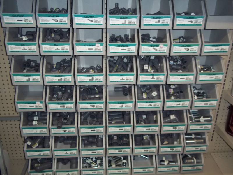 lot 1085 image: Shelf Display of PVC Poly Connectors