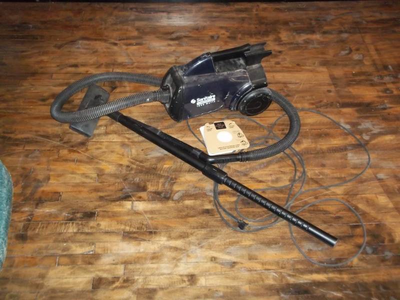 lot 1209 image: Used  Sanitaire canister vac