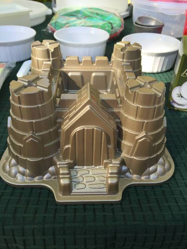 lot 102 image: Cooking & Tupperware Lot - Heavy Castle Cake Mold - Porcelain Olive Tray - Tortilla Warmer & More