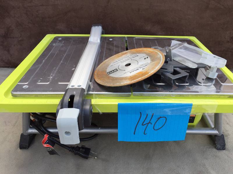 lot 140 image: Ryobi 7 Tile Saw- crack on plastic edge tested works
