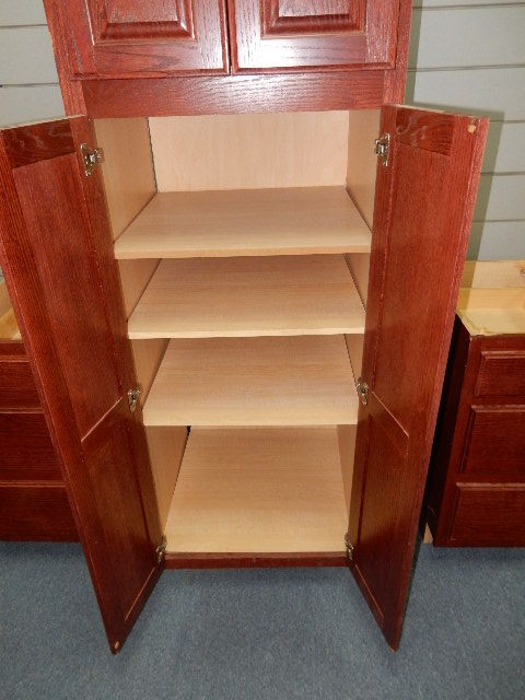 Tall Kitchen Cabinet.. 2 Sections. Oak fronts.. Stained a redish brown.. Matches lots 18, 19