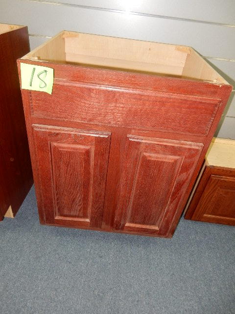 2 Lower cabinets.. 1 for a sink, 1 with drawers.  Good for a bathroom or maybe a kitchen.  Match lots 17, 19