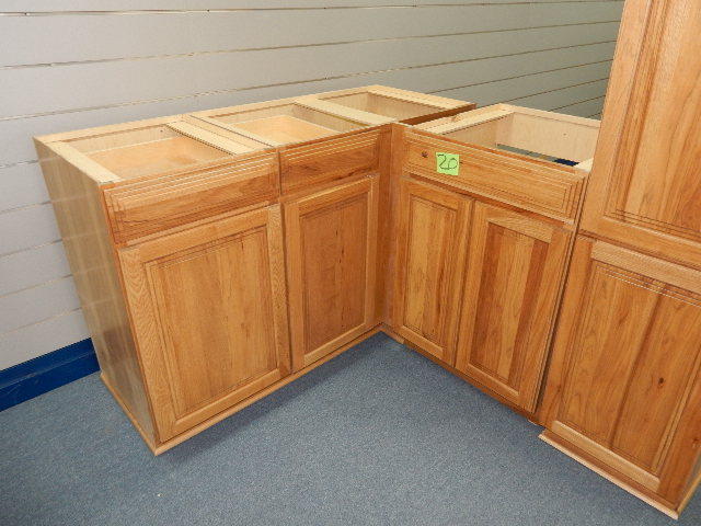 Lower Cabinets and tall kitchen storage cabinet.  Solid Hickory fronts.. Simulated wood sides..