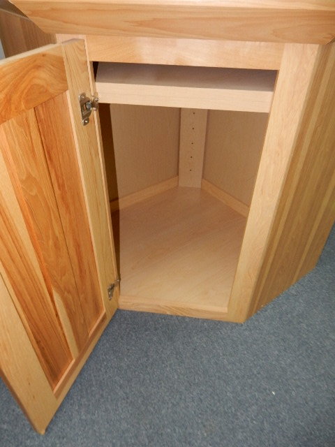 Hickory upper and lower cabinets.  Top have large cove molding.