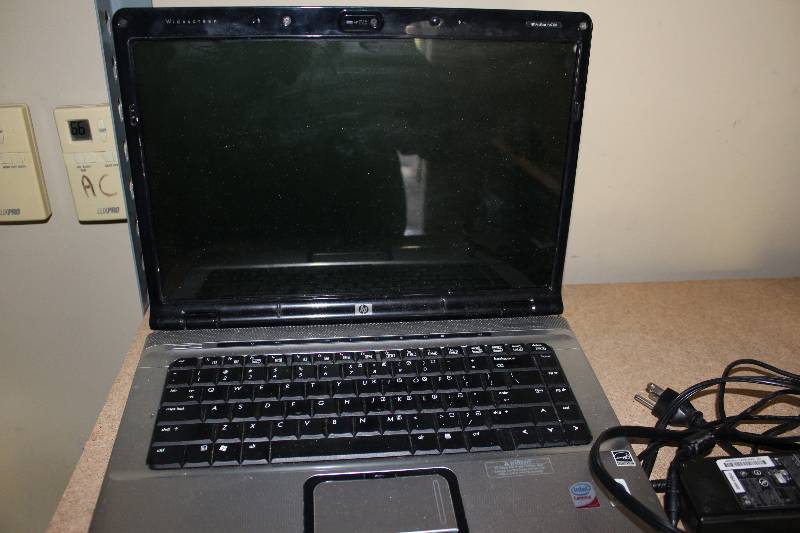 lot 26 image: HP Laptop with ac adapter, as is for parts