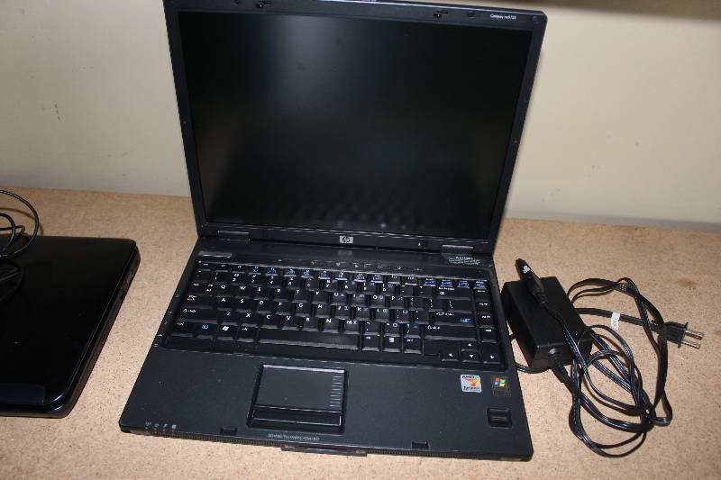 lot 22 image: HP Laptop with ac adapter, as is for parts