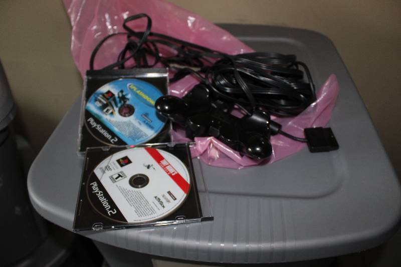 lot 58 image: Playstation controlers and games, tested and operational