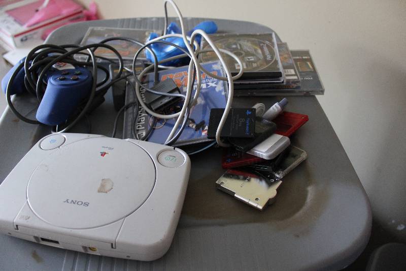 lot 59 image: Playstation controlers, console and games, tested and operational