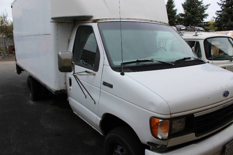 lot 1 image: 1994 ford e350 box truck with tommy gate, needs to be towed, will sometimes start, but has trouble idling, needs new egr tube(included) needs new markers lights(included), clean title