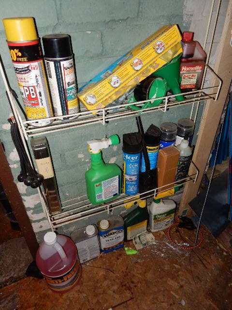 lot 238 image: Wall of liquids and other items..