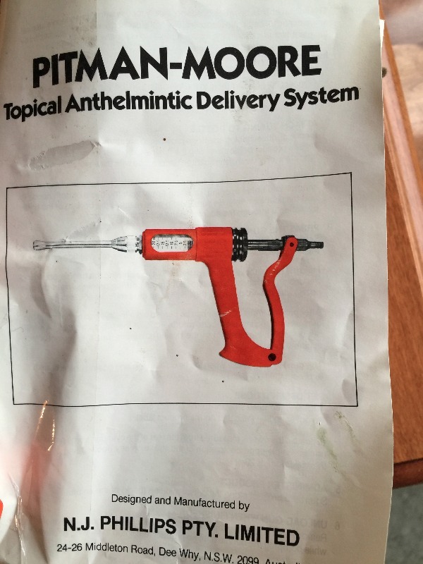 lot 51 image: New Pitman-Moore Topical Anthelmintic Delivery System  Appears to be a medicine delivery device for large farm animals
